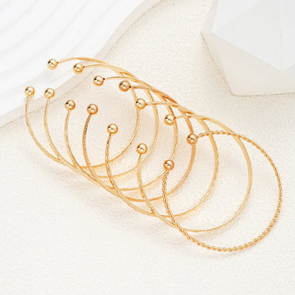 7-Piece Gold Heart Stackable Bracelet Set | Punk & Boho-Chic Cuff Collection