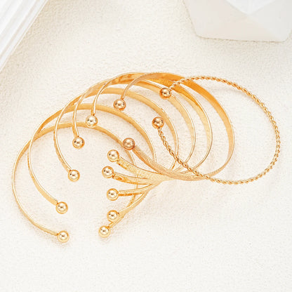 7-Piece Gold Heart Stackable Bracelet Set | Punk & Boho-Chic Cuff Collection